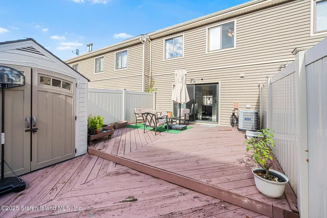 a very nice looking house with potted plants in front of it