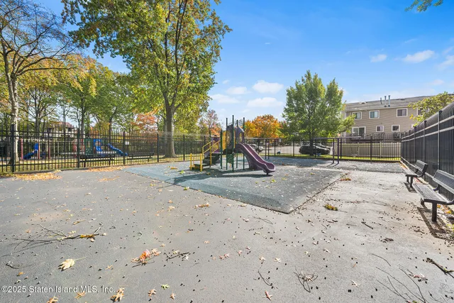 a view of a park with swings and slides