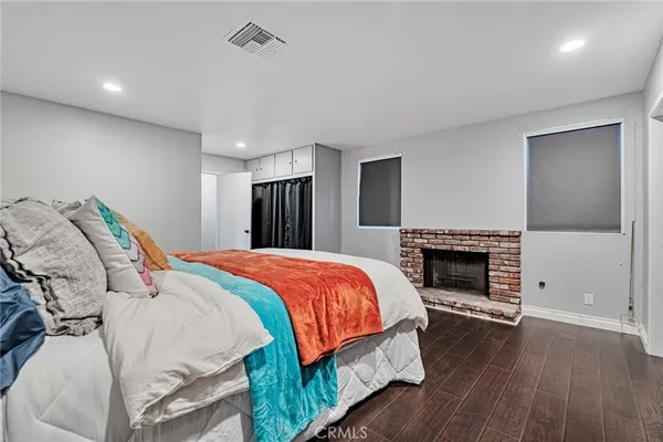 a bed room with a bed and a fireplace