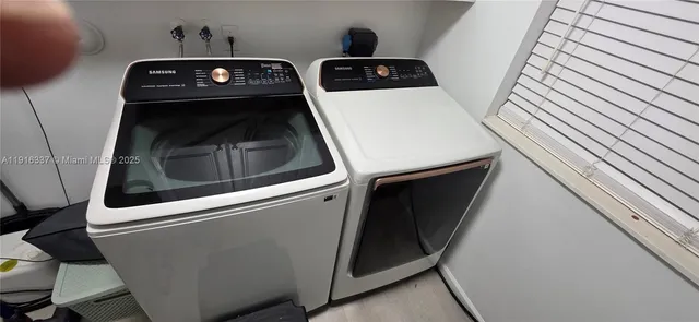 a utility room with dryer and washer