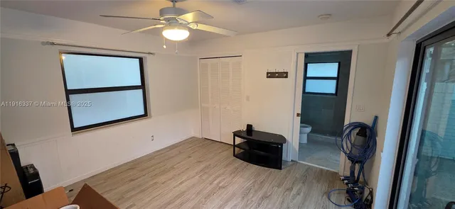 a room with furniture and wooden floor