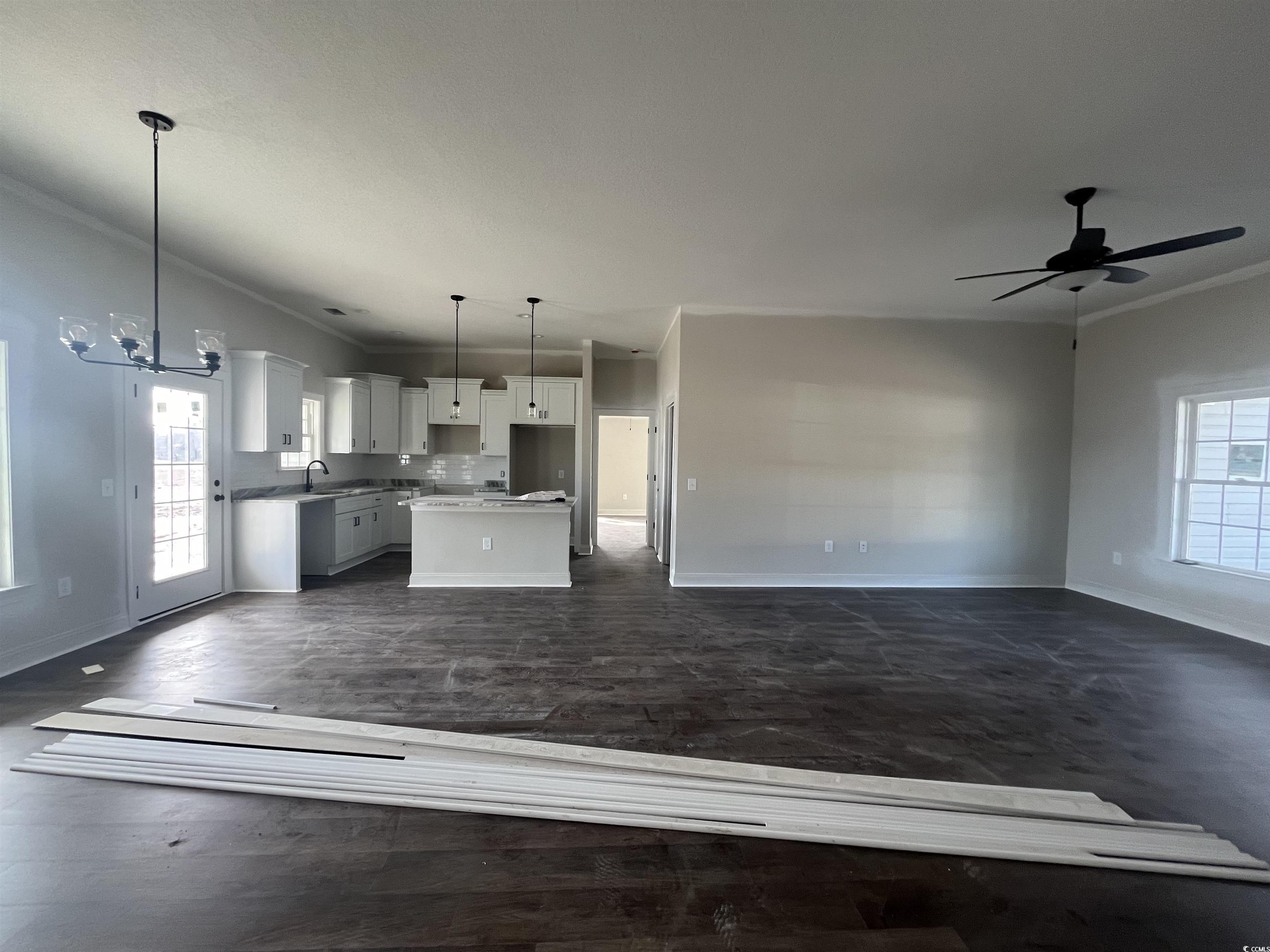 483 Highway 348 Loris, SC 29569 - Photo 4 of 15 Kitchen with white cabinets, a kitchen island, pen