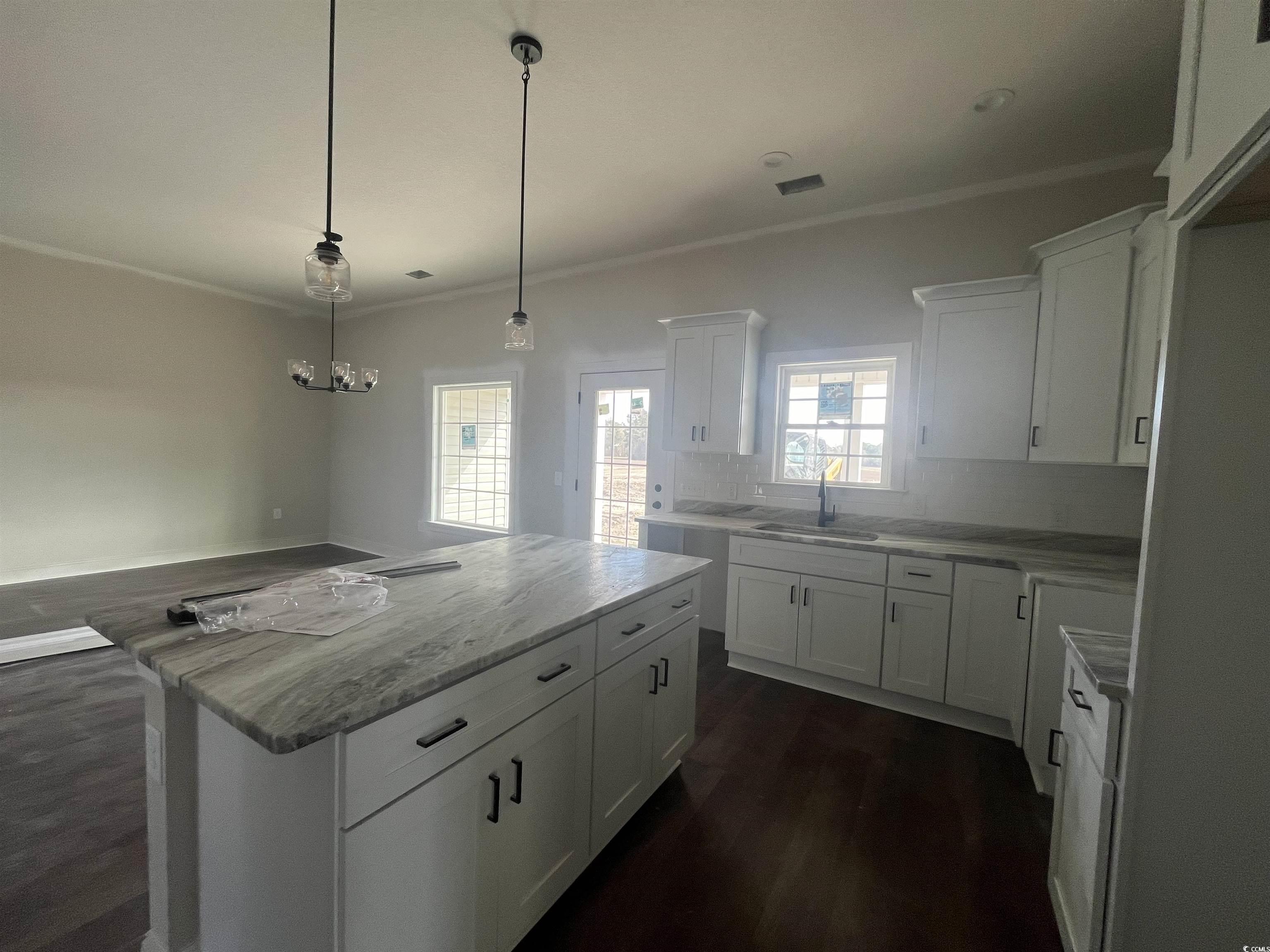 483 Highway 348 Loris, SC 29569 - Photo 9 of 15 Kitchen with crown molding, a sink, a kitchen isla