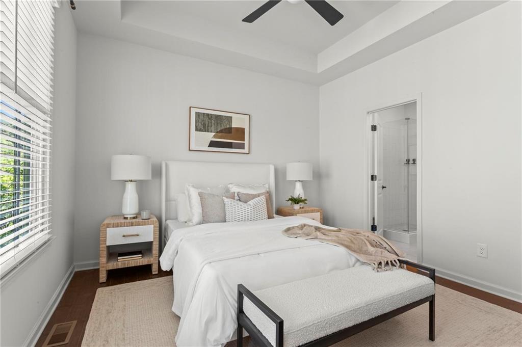 718 Needletail Way Atlanta, GA 30312 - Photo 19 of 44 a bedroom with a bed and a painting on the wall