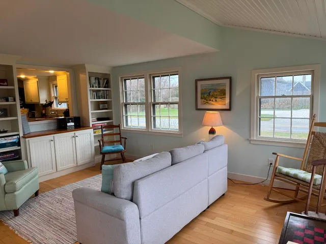 a living room with furniture and windows