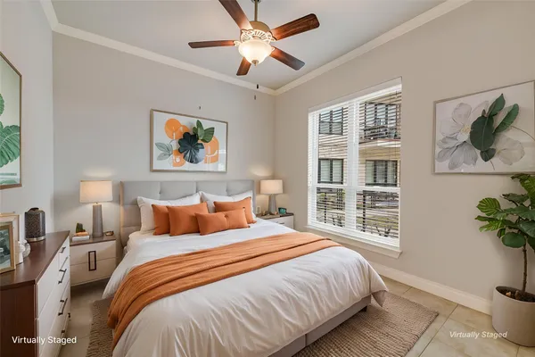 a bedroom with bed and a window