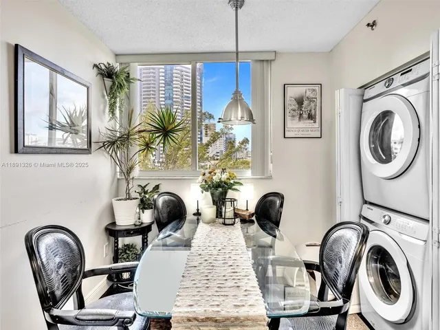 a view of a livingroom with furniture and windows