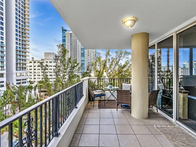 a view of a balcony with chairs