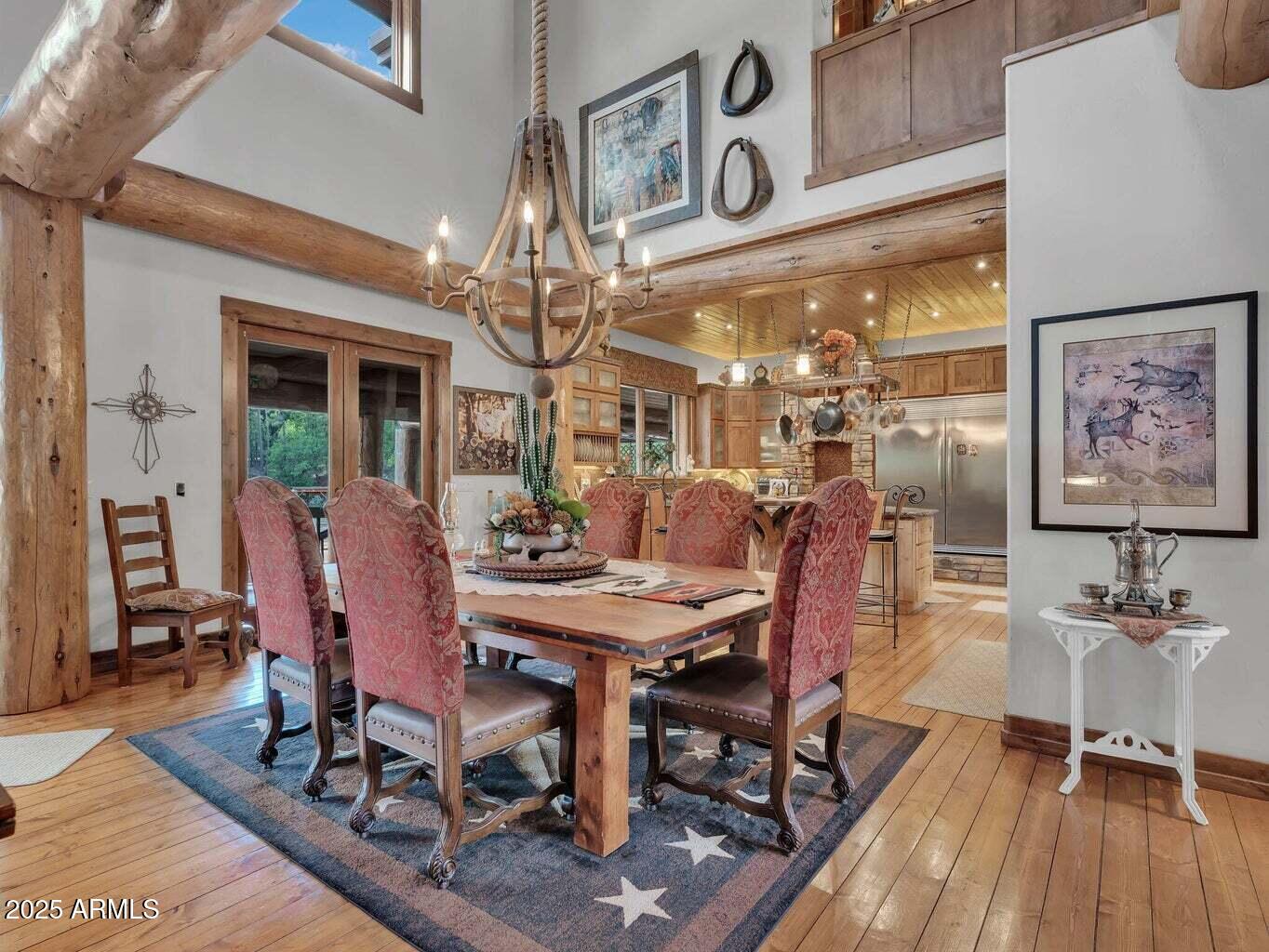 9361 Juniper Road Strawberry, AZ 85544 - Photo 18 of 104 a view of a dining room with furniture and wooden floor