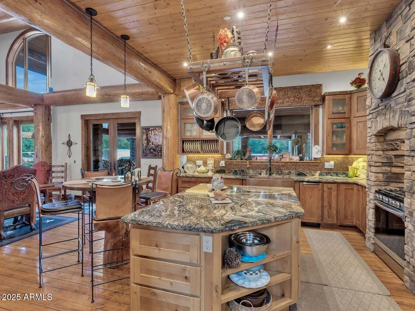 9361 Juniper Road Strawberry, AZ 85544 - Photo 22 of 104 a view of a kitchen with stainless steel appliances granite countertop a stove and cabinets