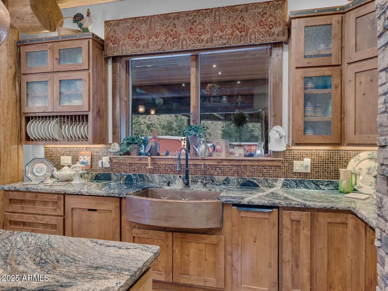 9361 Juniper Road Strawberry, AZ 85544 - Photo 24 of 104 a kitchen with granite countertop kitchen island a sink and a window