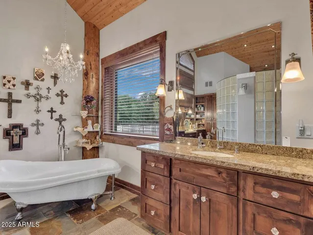 a backyard of a house with a yard and outdoor seating