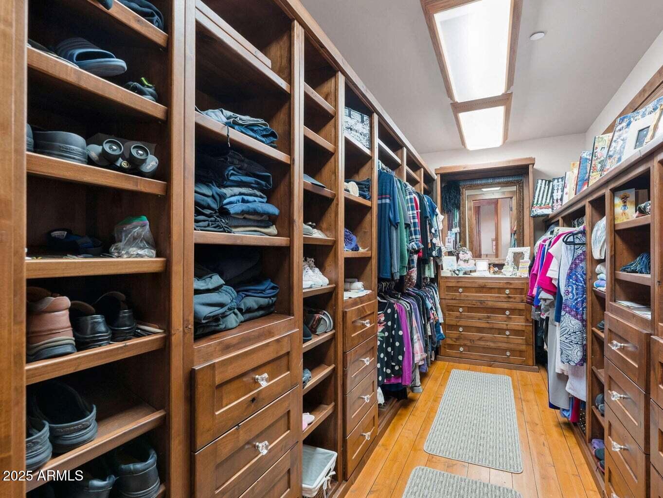 9361 Juniper Road Strawberry, AZ 85544 - Photo 35 of 104 a view of walk in closet with clothes and shoes