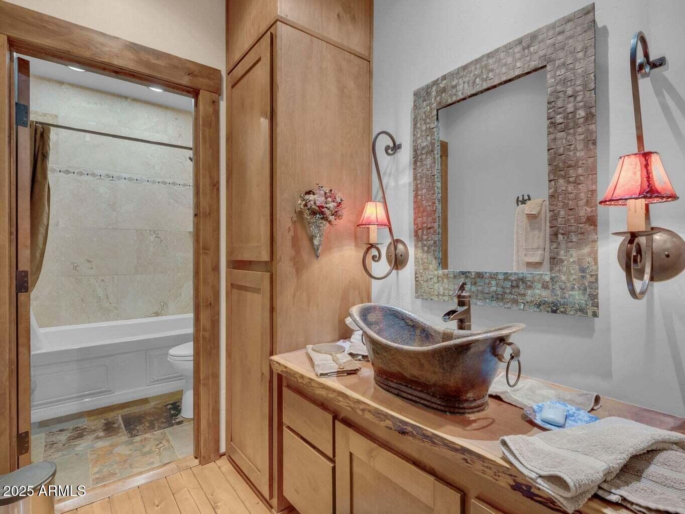 9361 Juniper Road Strawberry, AZ 85544 - Photo 41 of 104 a bathroom with a granite countertop sink and a mirror