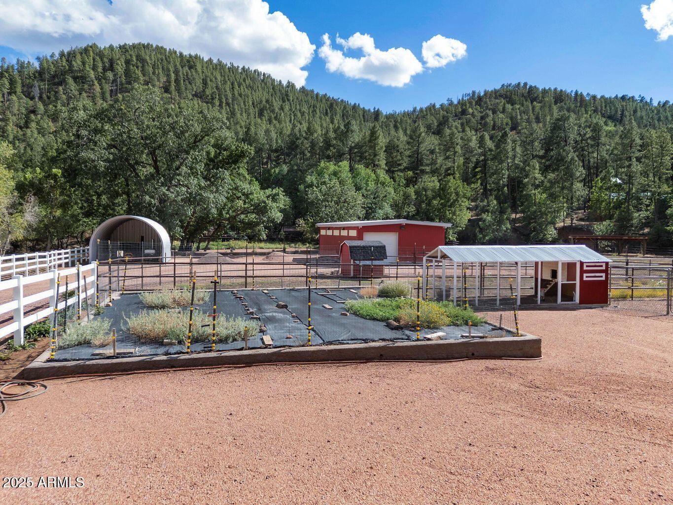 9361 Juniper Road Strawberry, AZ 85544 - Photo 64 of 104 a backyard of a house with a yard and outdoor seating