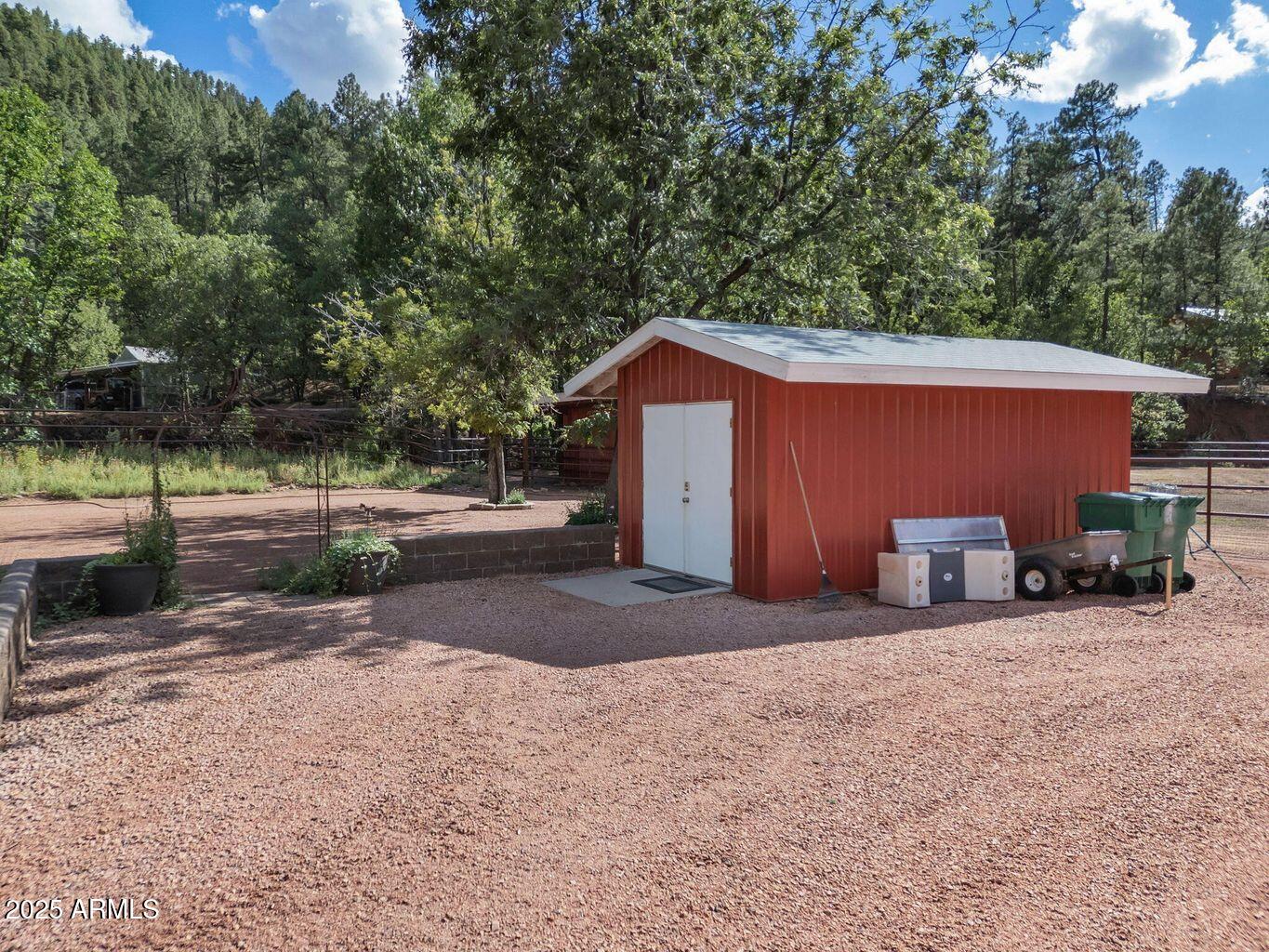 9361 Juniper Road Strawberry, AZ 85544 - Photo 78 of 104 a view of a house with backyard and trees