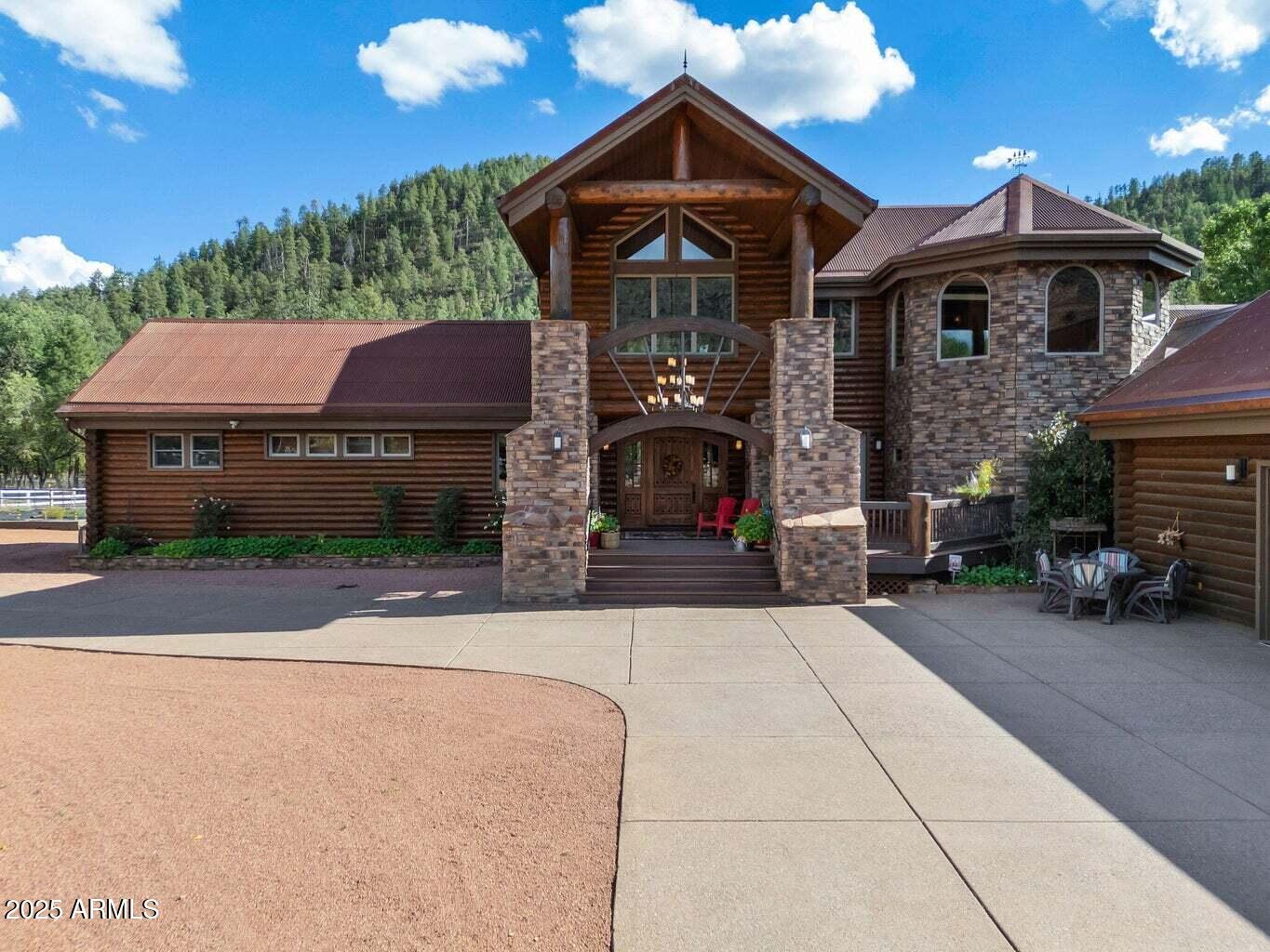 9361 Juniper Road Strawberry, AZ 85544 - Photo 8 of 104 a front view of a house with a yard