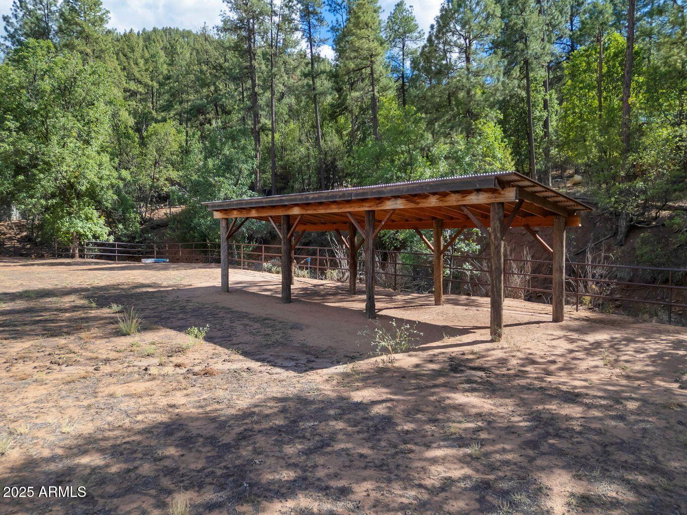 9361 Juniper Road Strawberry, AZ 85544 - Photo 83 of 104 a view of a backyard with large trees