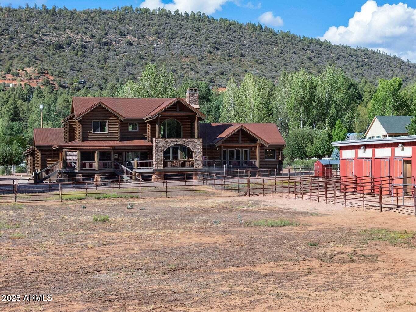 9361 Juniper Road Strawberry, AZ 85544 - Photo 89 of 104 a front view of a house with garden
