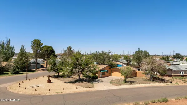 a view of a house with a snow on the road