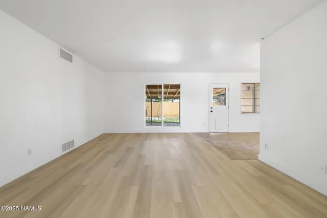 an empty room with windows