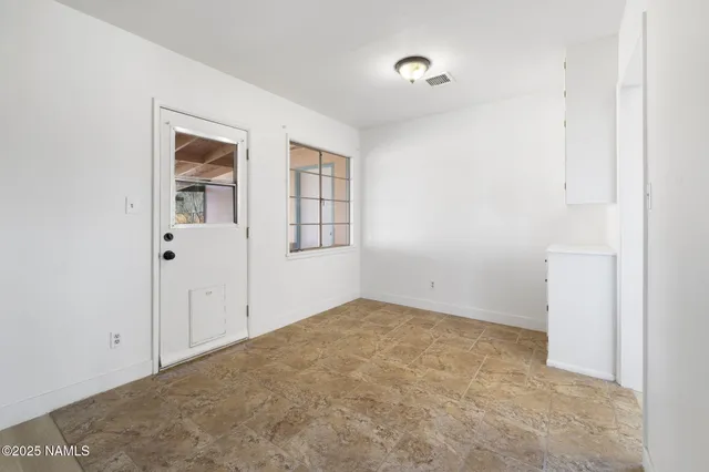 an empty room with windows