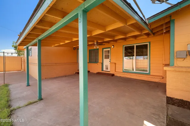 a view of a backyard of the house
