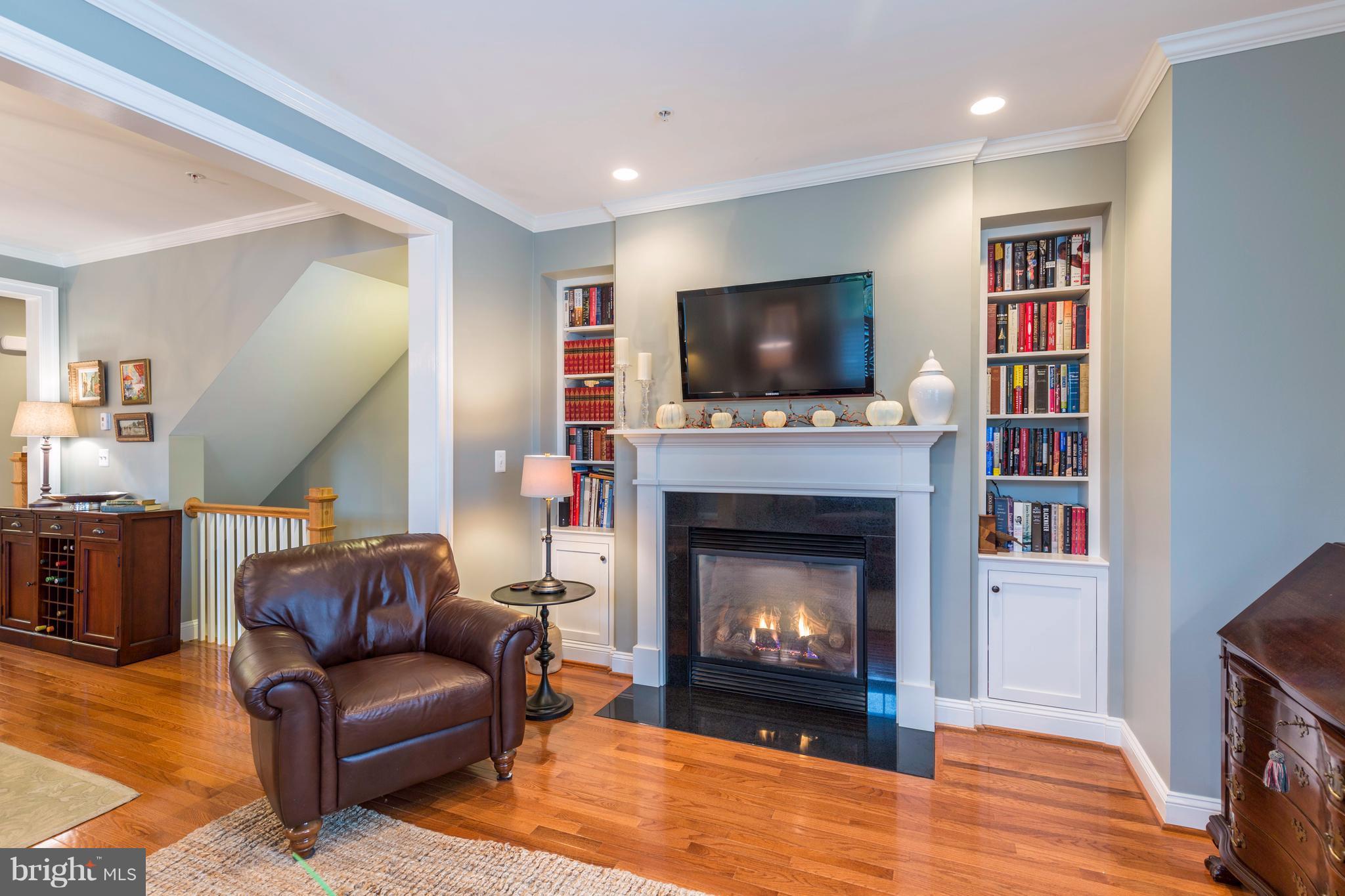 8815 Courts Way Silver Spring, MD 20910 - Photo 17 of 30 Addition of Gas FP & Bookcases Warm the Room