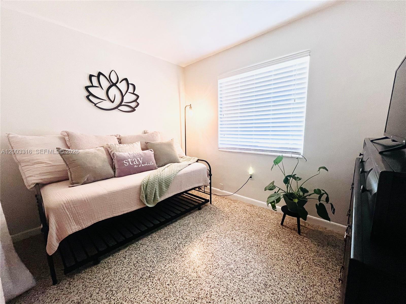 9840 Southwest 165th Terrace Miami, FL 33157 - Photo 13 of 13 a bedroom with a bed and a couch