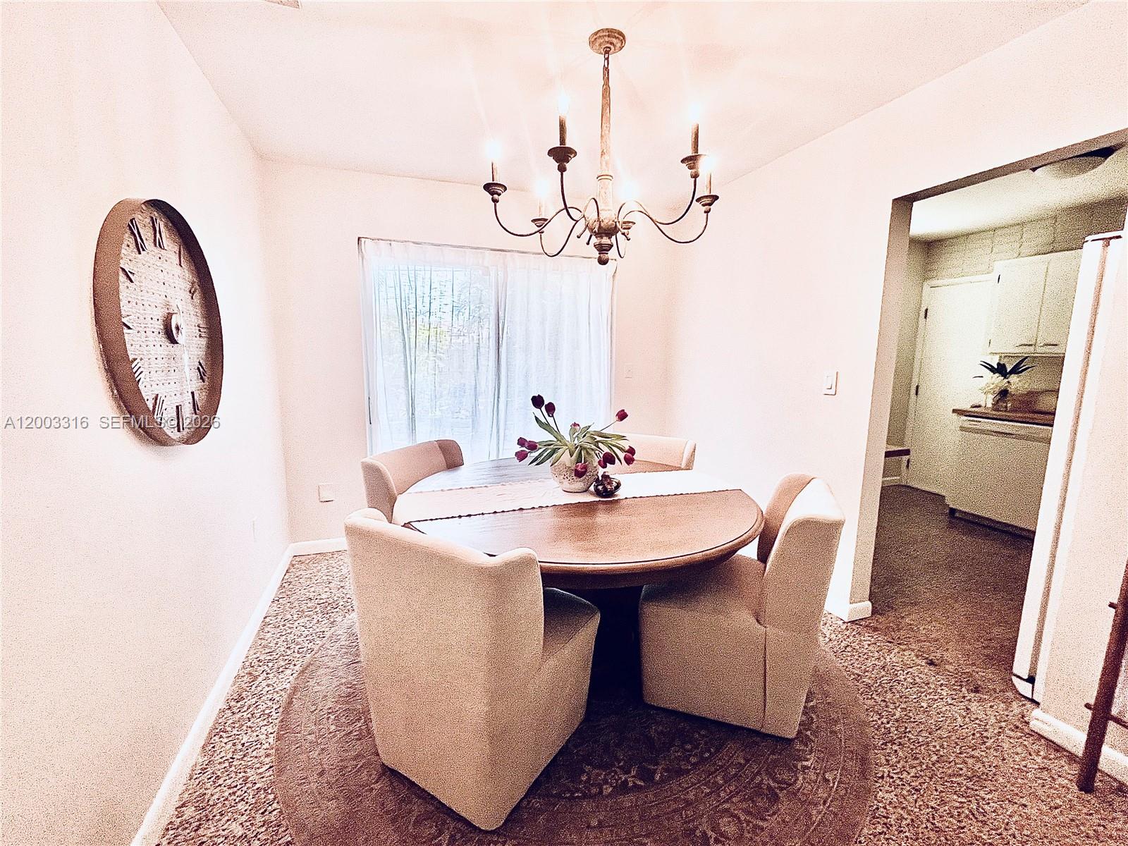 9840 Southwest 165th Terrace Miami, FL 33157 - Photo 4 of 13 a view of a very nice looking dining room with a table and chairs