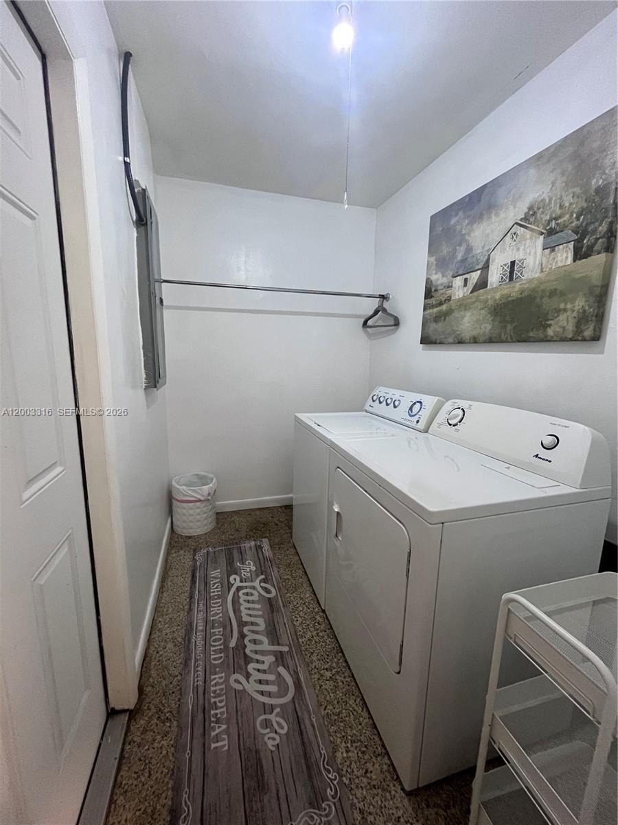 9840 Southwest 165th Terrace Miami, FL 33157 - Photo 5 of 13 a utility room with dryer and washer