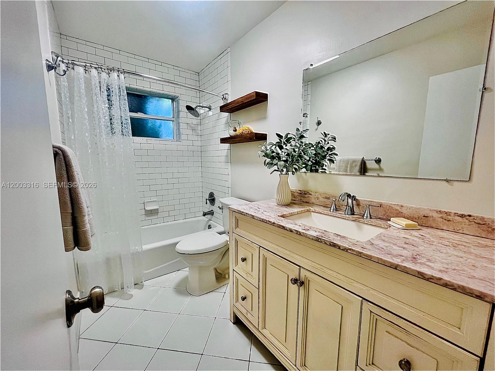 9840 Southwest 165th Terrace Miami, FL 33157 - Photo 6 of 13 a bathroom with a granite countertop sink mirror and toilet