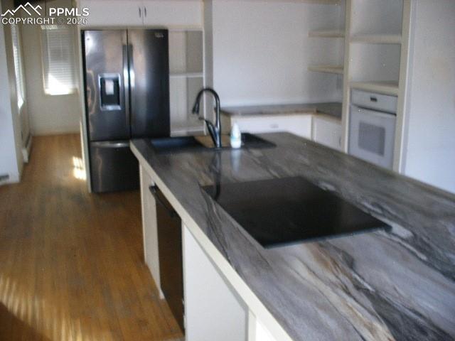 1360 Fawnwood Road Monument, CO 80132 - Photo 15 of 50 a kitchen with a sink and chandelier
