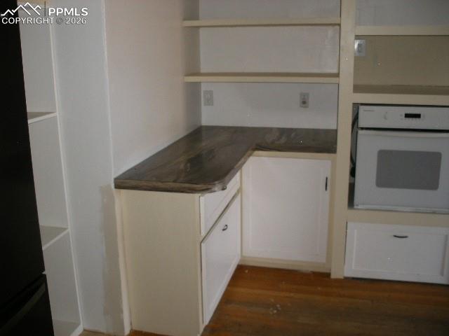1360 Fawnwood Road Monument, CO 80132 - Photo 17 of 50 a kitchen with white cabinets and a sink