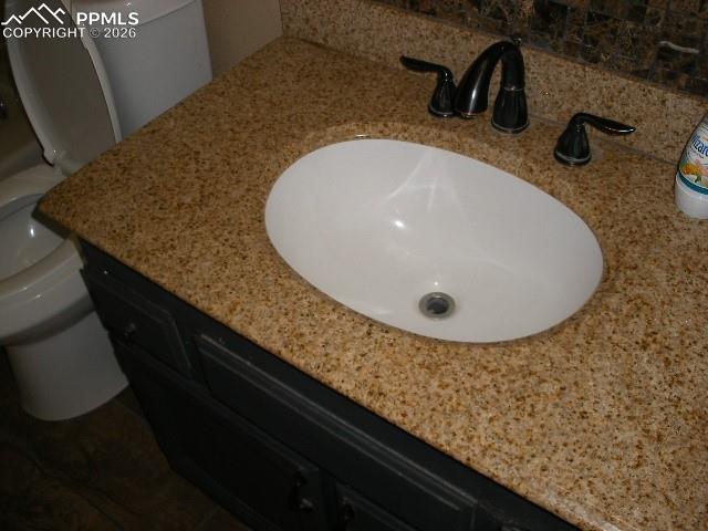1360 Fawnwood Road Monument, CO 80132 - Photo 18 of 50 a bathroom with a sink and mirror