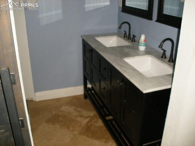 1360 Fawnwood Road Monument, CO 80132 - Photo 22 of 50 a bathroom with a sink and a mirror