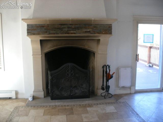 1360 Fawnwood Road Monument, CO 80132 - Photo 47 of 50 a living room with a fireplace