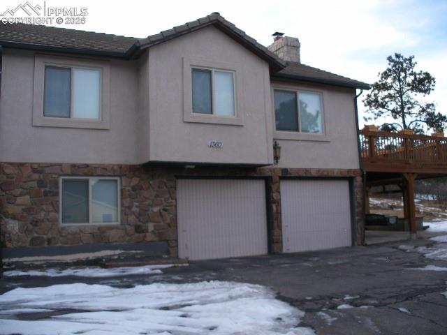 1360 Fawnwood Road Monument, CO 80132 - Photo 6 of 50 a front view of a house with parking