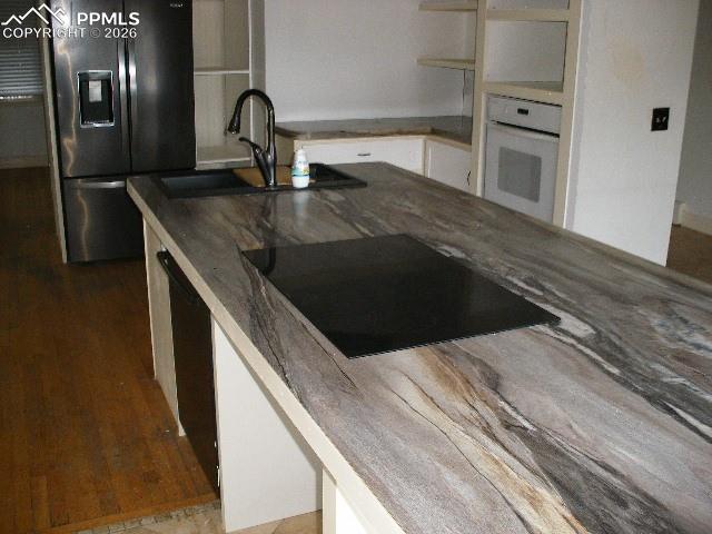 1360 Fawnwood Road Monument, CO 80132 - Photo 7 of 50 a kitchen with a sink and an oven