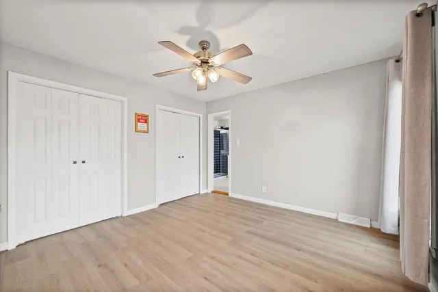 a bathroom with a toilet sink and shower
