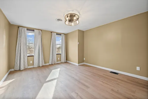 a view of a livingroom with wooden floor