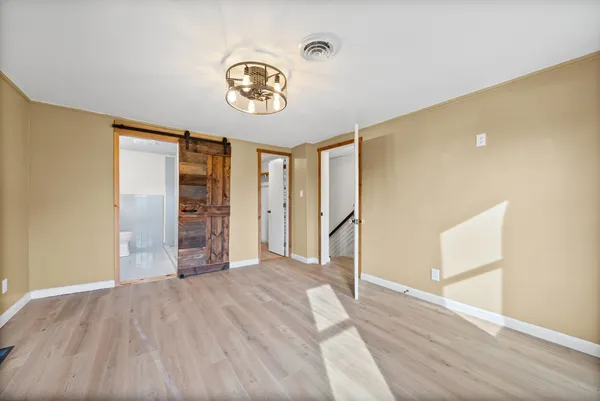 a view of staircase with white walls