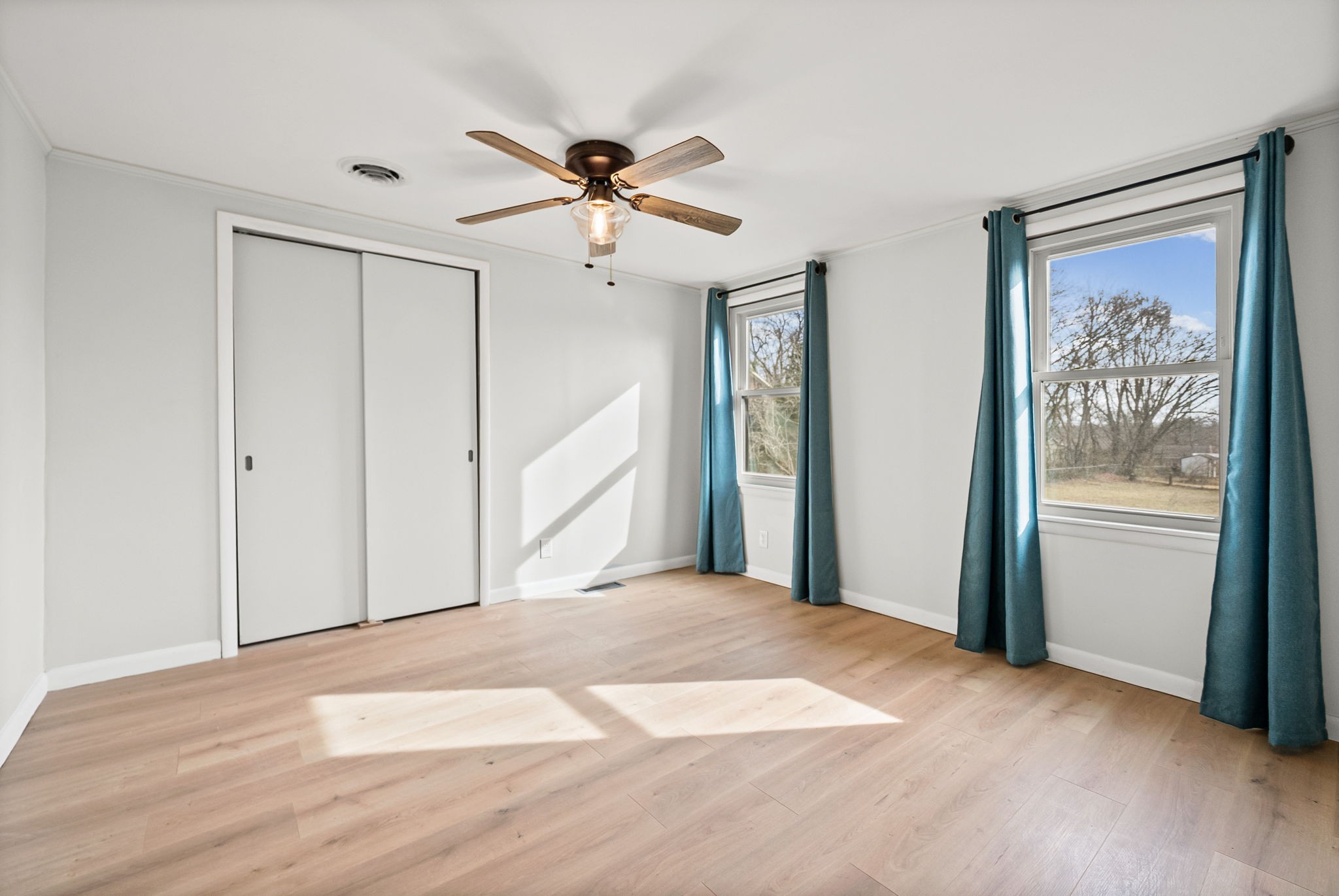 3012 Cox Mill Road Hopkinsville, KY 42240 - Photo 27 of 37 a view of a big room with wooden floor and windows in a room