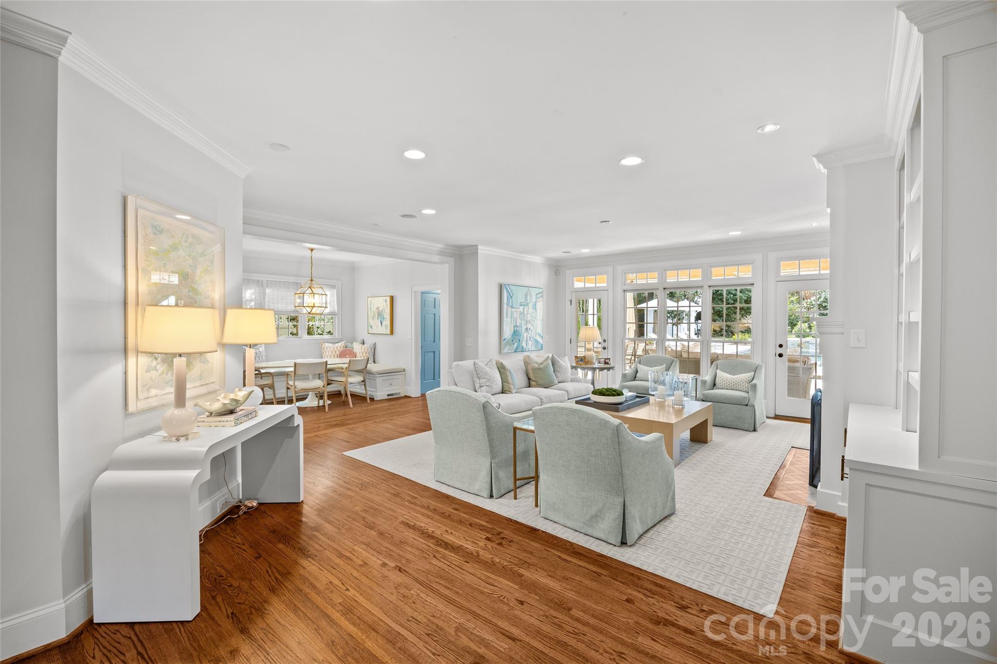 1950 Sterling Road Charlotte, NC 28209 - Photo 11 of 48 a living room with lots of furniture wooden floor and a large window