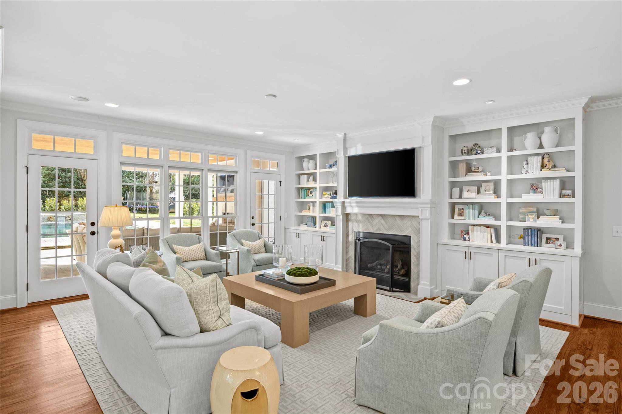 1950 Sterling Road Charlotte, NC 28209 - Photo 12 of 48 a living room with furniture a fireplace and a flat screen tv