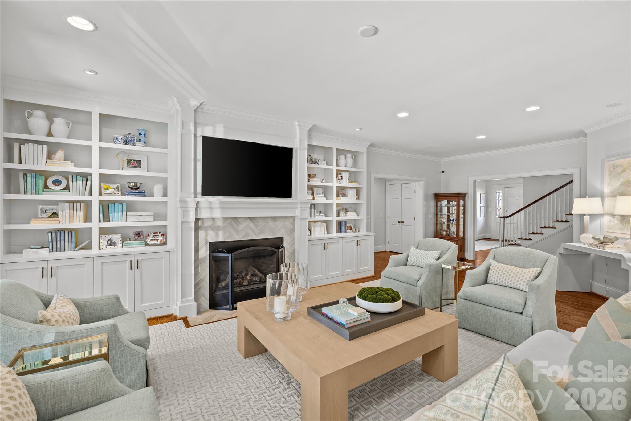 1950 Sterling Road Charlotte, NC 28209 - Photo 13 of 48 a living room with furniture a fireplace and a flat screen tv