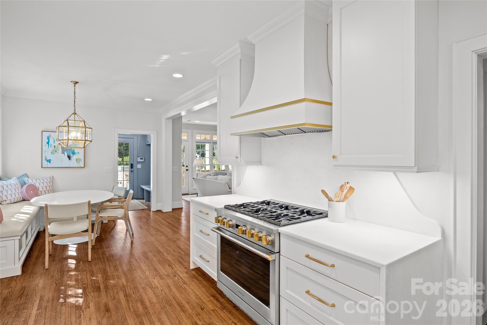 1950 Sterling Road Charlotte, NC 28209 - Photo 16 of 48 a kitchen with a stove a sink dishwasher and a refrigerator with wooden floor