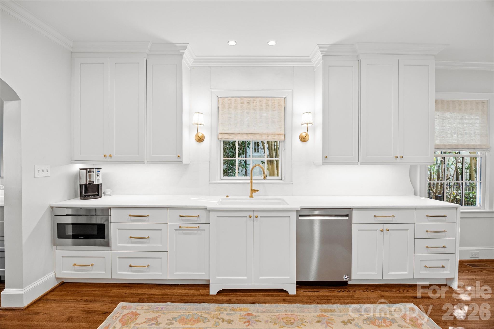 1950 Sterling Road Charlotte, NC 28209 - Photo 17 of 48 a kitchen with stainless steel appliances granite countertop a sink and cabinets with wooden floor
