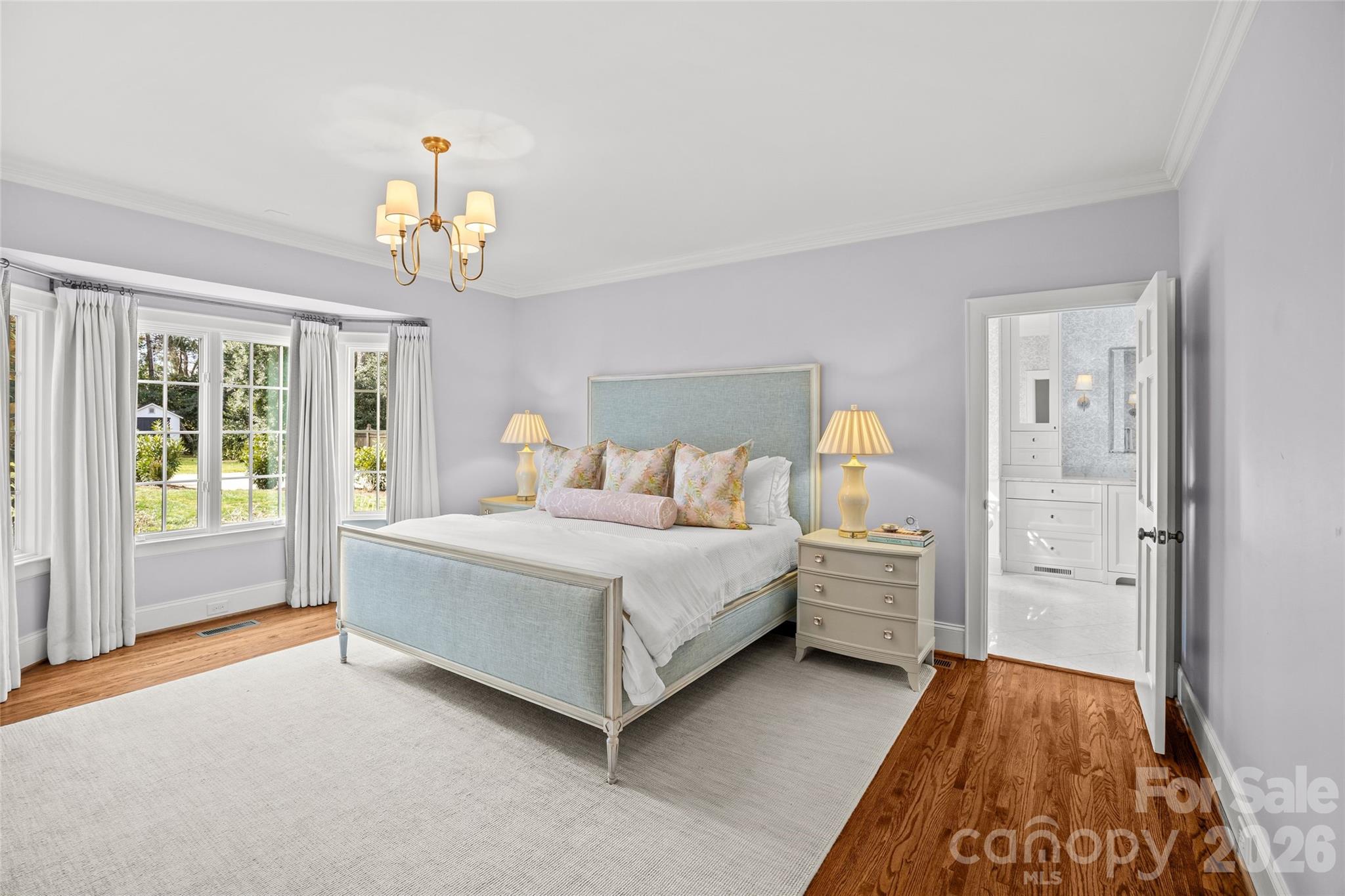 1950 Sterling Road Charlotte, NC 28209 - Photo 24 of 48 a spacious bedroom with a bed and a table in it