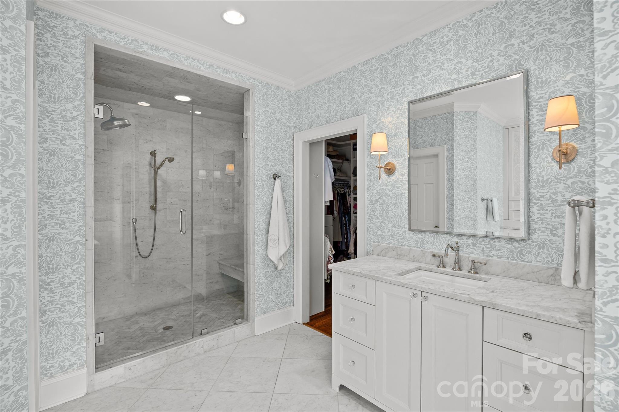 1950 Sterling Road Charlotte, NC 28209 - Photo 27 of 48 a bathroom with a shower tub double sink and mirror
